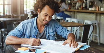 Male student working on his assignment