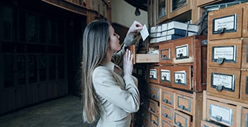 Female student looking at reference cards